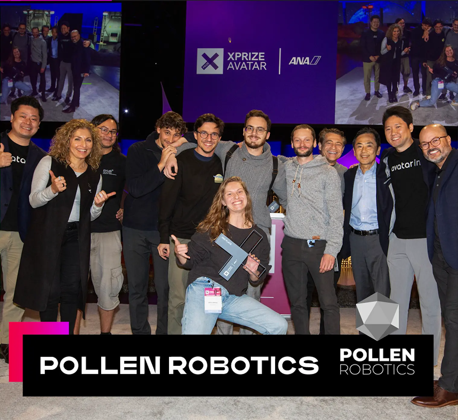 The Pollen Robotics team on stage at the ANA Avatar XPRIZE finals, gathered around the trophy in front of the purple XPRIZE backdrop.