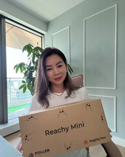 Holding the Reachy Mini box the day it arrived, shared by Gillian Cai, MBA, B.Tech (Comp Sc) ✨