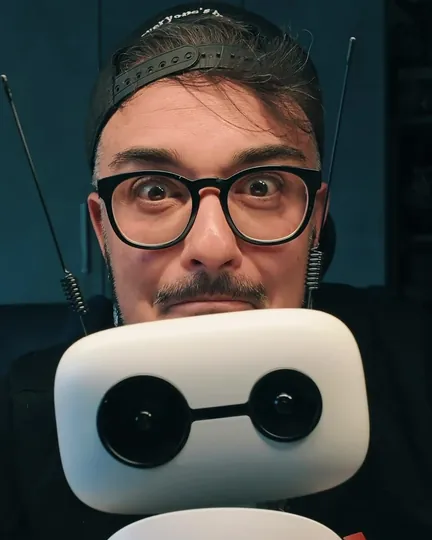A maker posing cheek to cheek with Reachy Mini, shared by umarts_3d_lab