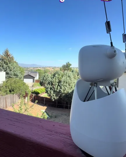 Reachy Mini on a deck, looking out at the Colorado Front Range, shared by Olivia + Brie 🕯️