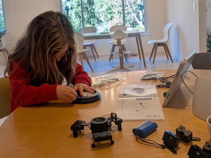 A 6-year-old girl building her Reachy Mini, shared by Steren