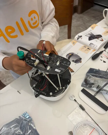A kid assembling Reachy Mini on his own, shared by Lisa Guan