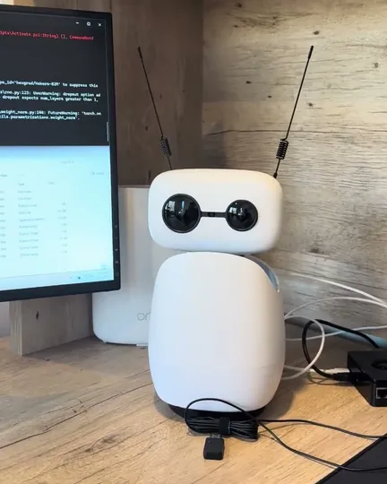 Nori, a Reachy Mini character, on the desk, shared by Together We Talk (Harrison Gray)