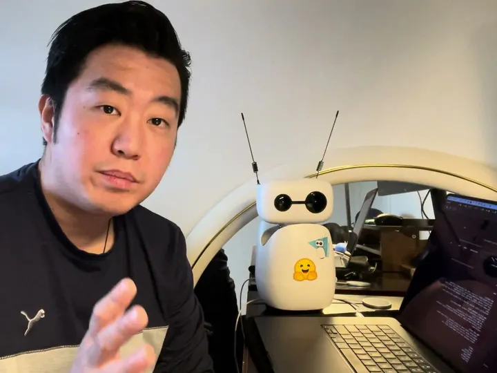 Testing Reachy Mini at the laptop, shared by Yiqiao Yin