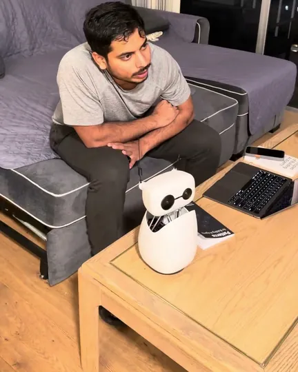 Reachy Mini as an AI benchmate on the coffee table, shared by Lag Odhuu
