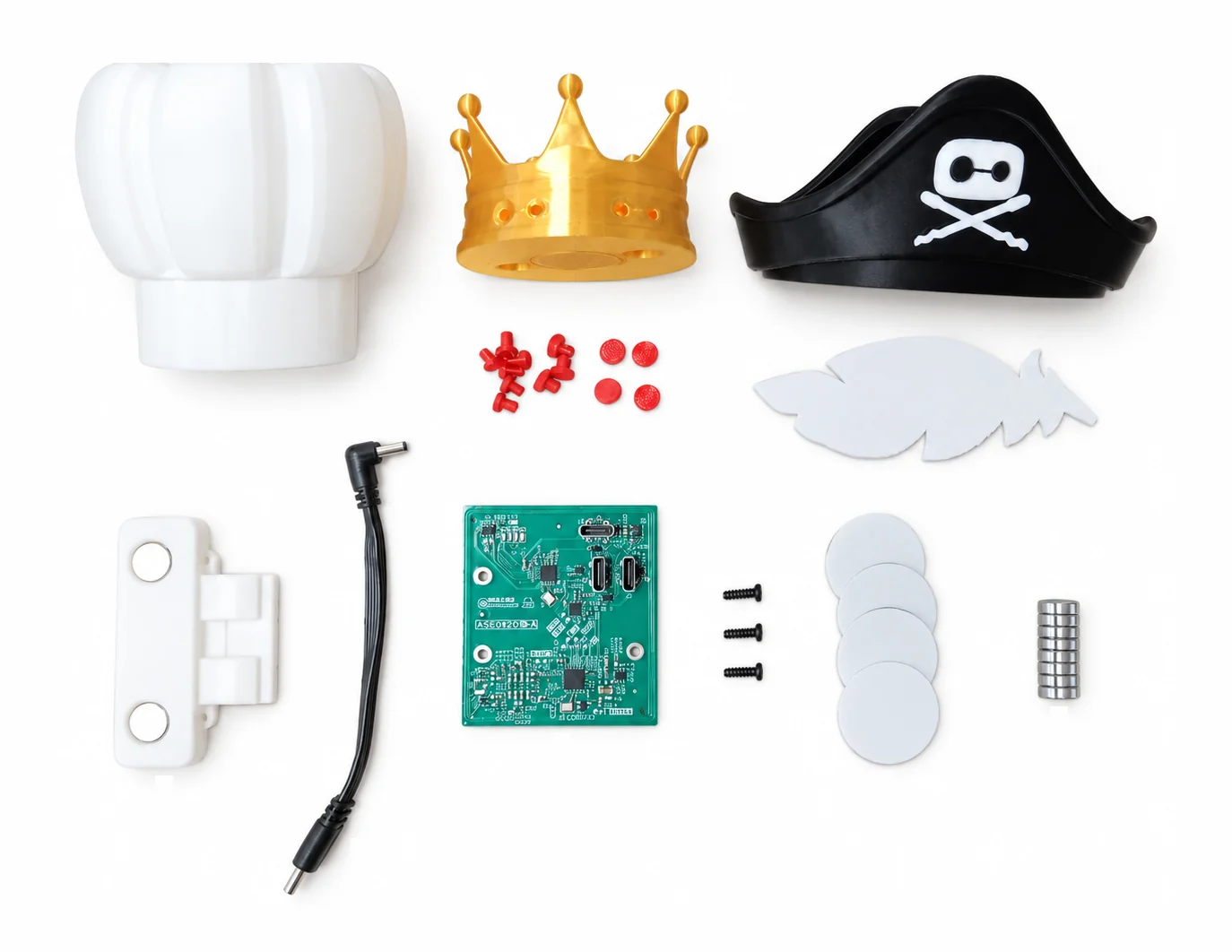 Everything in the NFC Accessory Pack laid out: chef hat, crown and gems, pirate hat and feather, the NFC module with its cable, board and screws, NFC tags and magnets