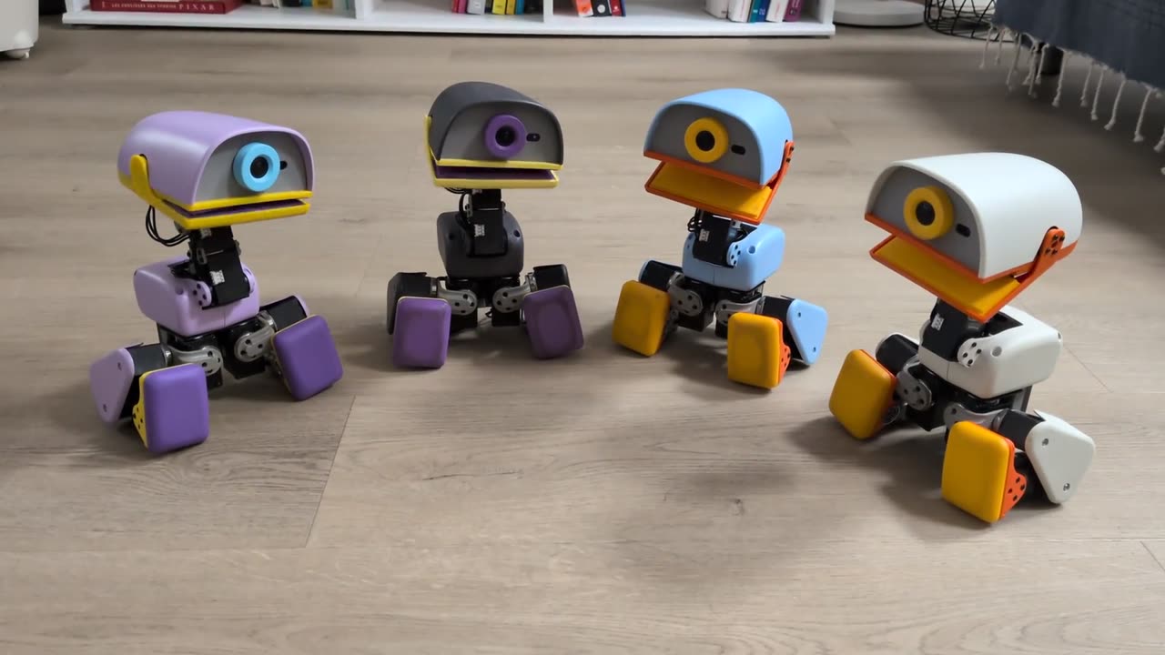 Four Microducks in the four colourways singing together like a choir